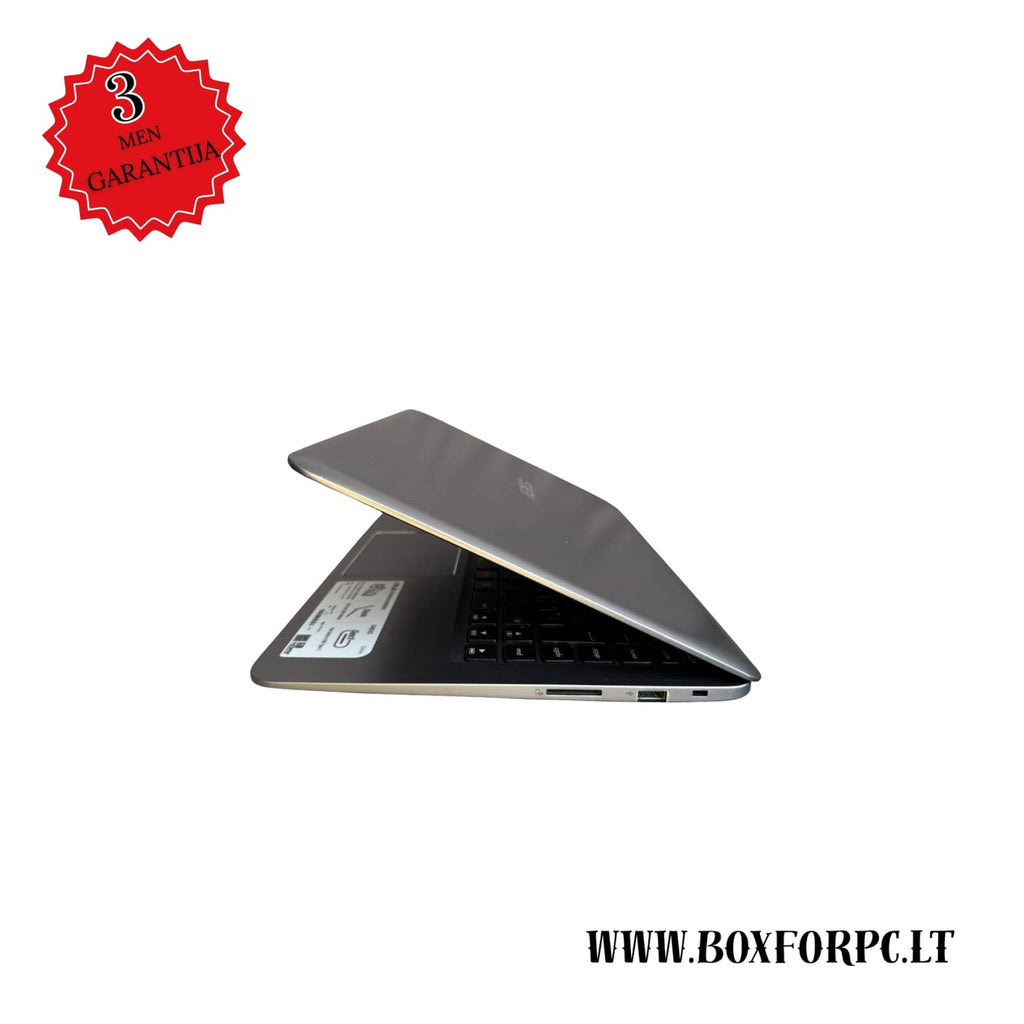 ASUS E406M laptopas – šoninis vaizdas, matomos jungtys ir plonas korpusas pasuktas i kaire